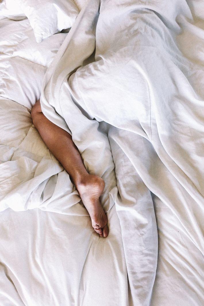 man kid sleeping on a bed