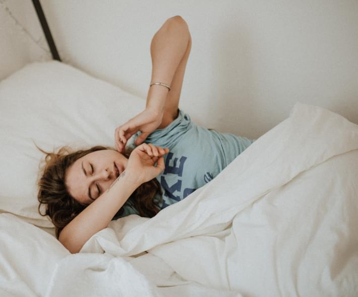 old illustration of kid sleeping on a bed